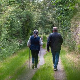 A couple walks on the Red Clover Path in Nyborg